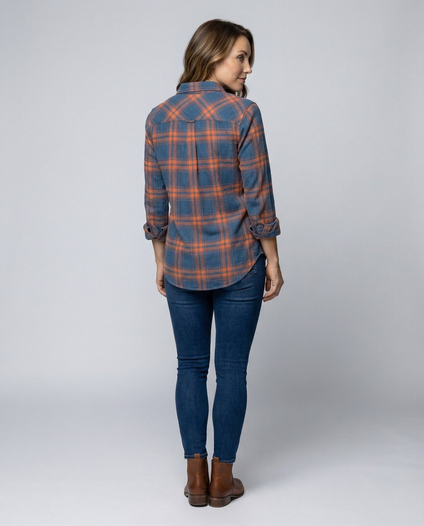 checkered shirt blouse with long sleeves, button front closure, and classic collar.