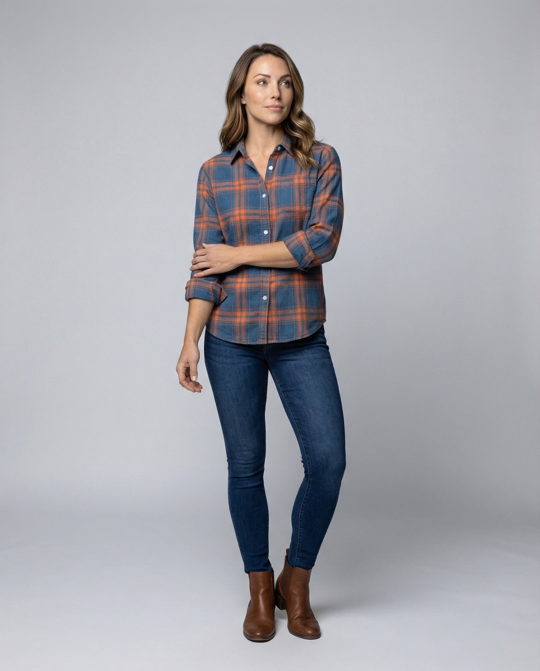 checkered shirt blouse with long sleeves, button front closure, and classic collar.