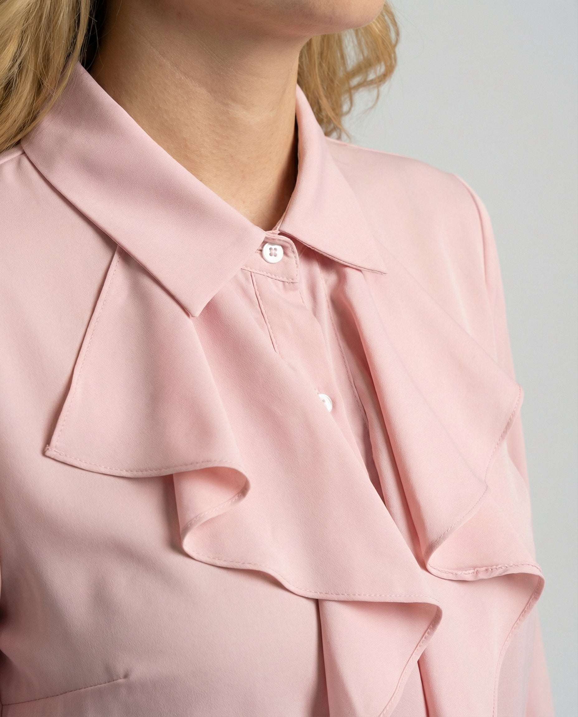 ruffle blouse with elegant feminine fit and decorative detailing